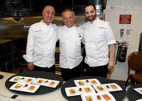 LAS VEGAS, NV - MAY 21:  (L-R) Chefs Nobu Matsuhisa, Wolfgang Puck, and Mario Carbone prepare food during Keep Memory Alives 20th Annual Power Of Love Gala at the MGM Grand Garden Arena on May 21, 2016 in Las Vegas City.  (Photo by Denise Truscello/Getty Images for Keep Memory Alive)